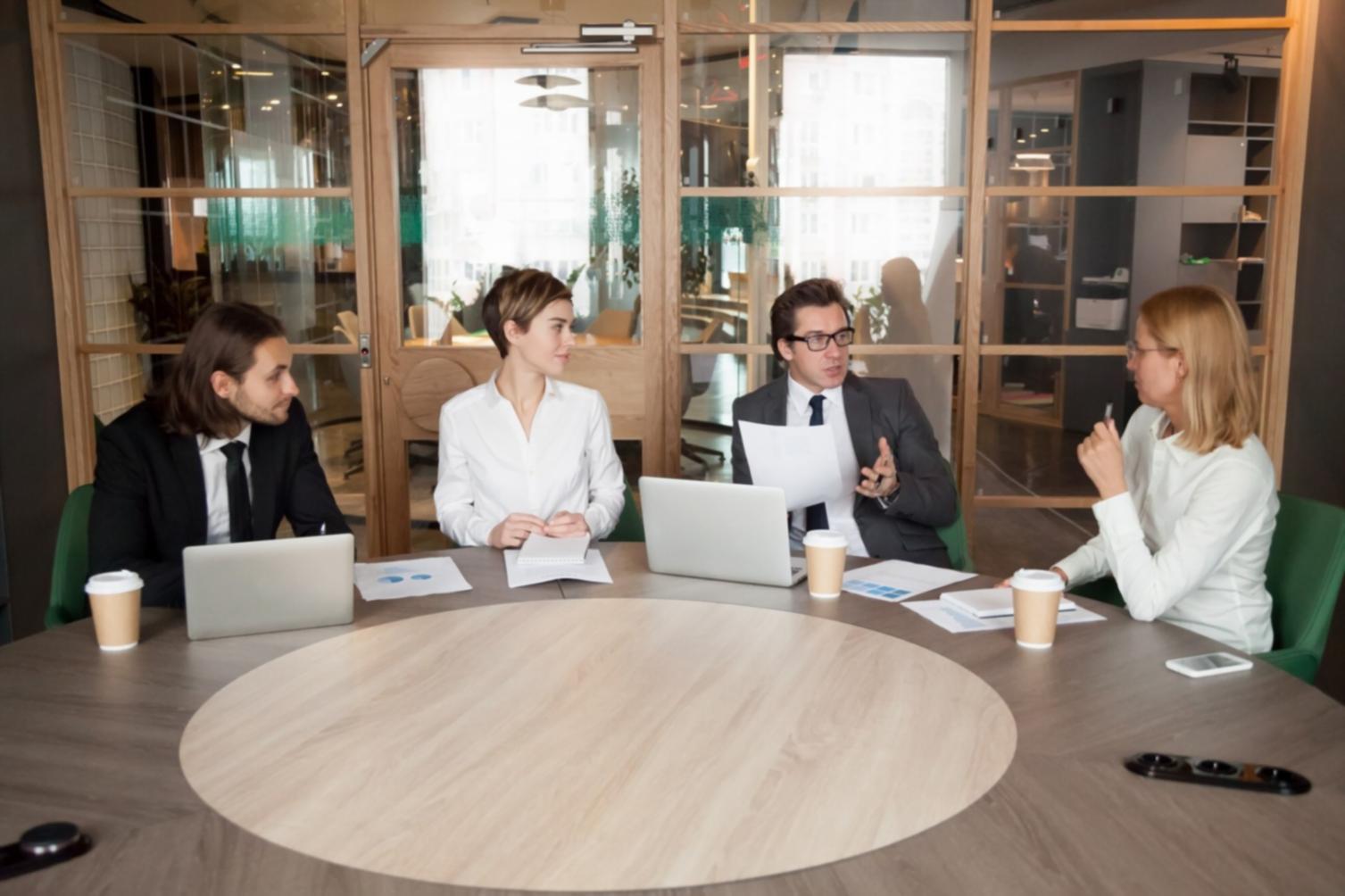 Team collaboration session reviewing financial reports